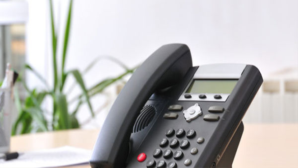 A Telephone on a desk using AdcommTVs phone services