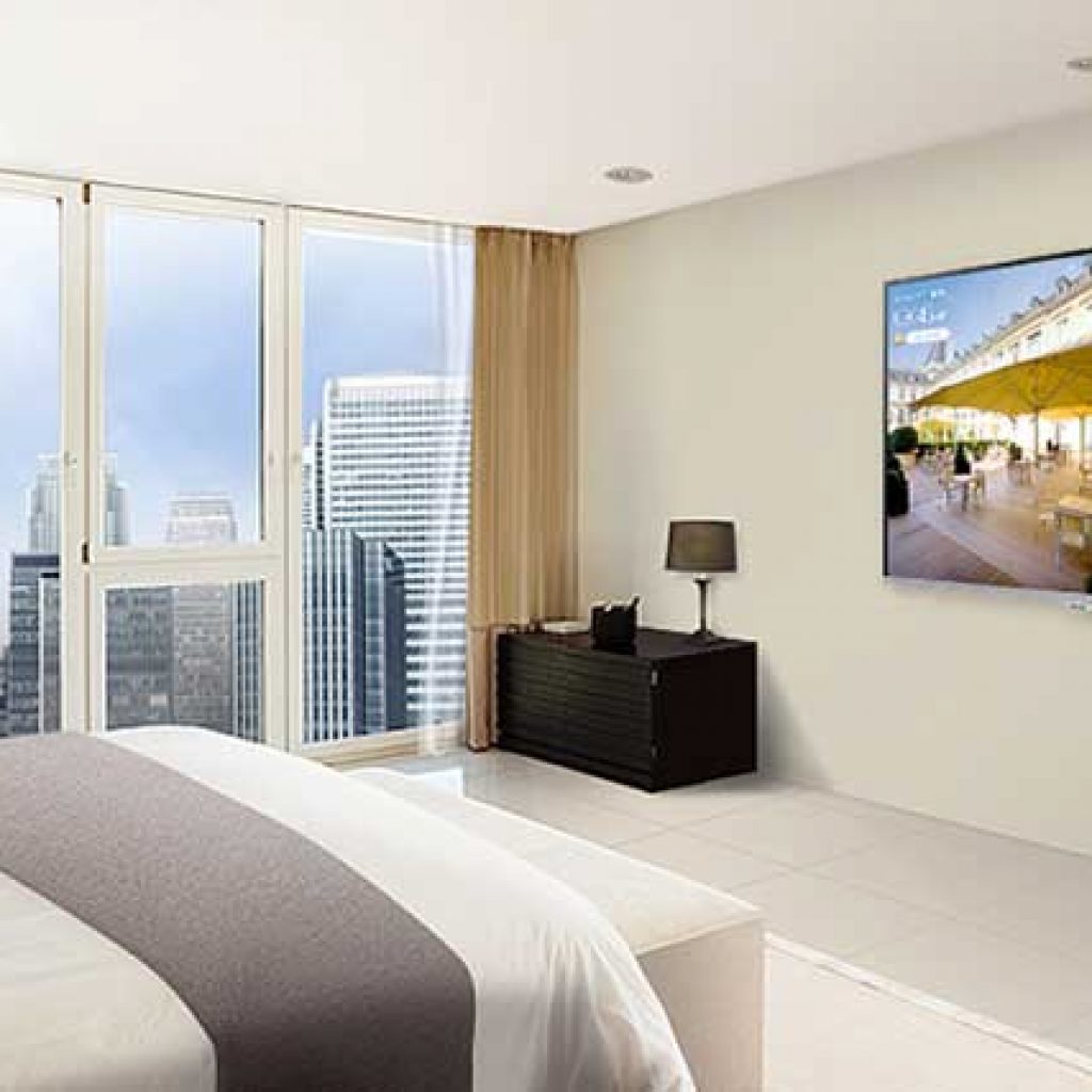 A Hotel room with a Samsung Hospitality Commercial TV on the wall