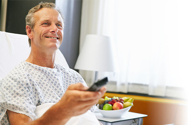 Man watching a Commercial TVs for Healthcare