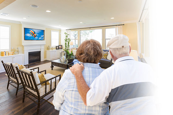 A Senior Couple watching an AdcommTV Commercial TV