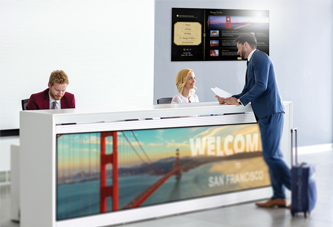 View of individuals discussing digital signage