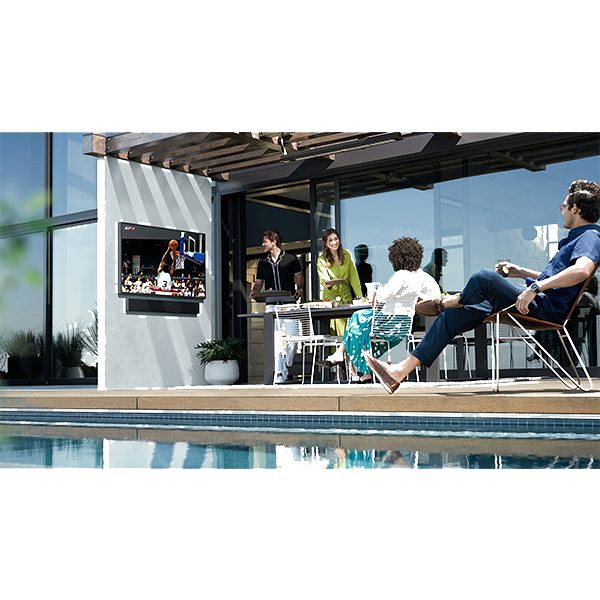 Guests poolside watching football on an outdoor tv